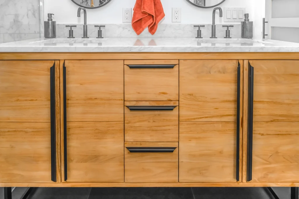Close-up of custom wood cabinetry with slim black hardware