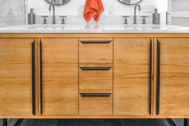 Close-up of custom wood cabinetry with slim black hardware